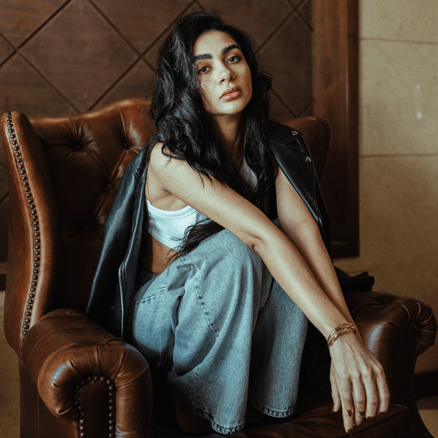 The scene is set indoors, possibly in a warmly lit, cozy room.