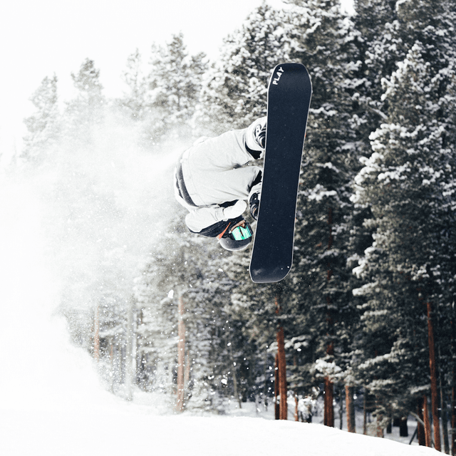 The scene is set outdoors on a snow-covered mountain, indicative of a crisp winter day.