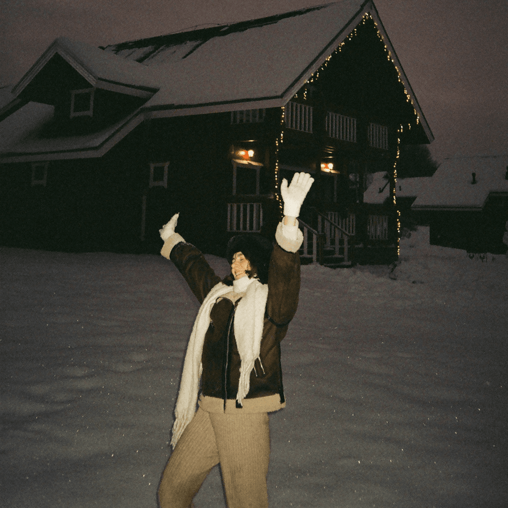 The scene takes place outdoors in a snowy landscape during the dusk or early evening, as the sky has a soft, dim hue indicating fading daylight.