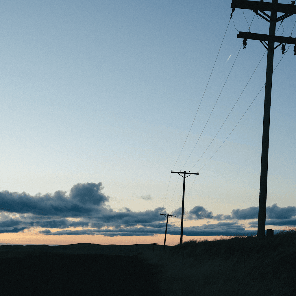 The scene is set outdoors during the twilight of early evening, just after the sun has dipped below the horizon.
