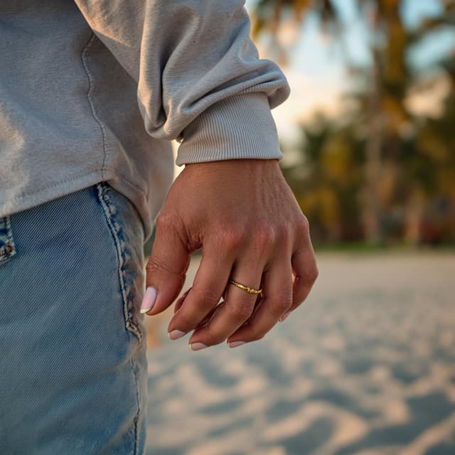 The scene takes place outdoors, along what appears to be a beach or coastal setting.
